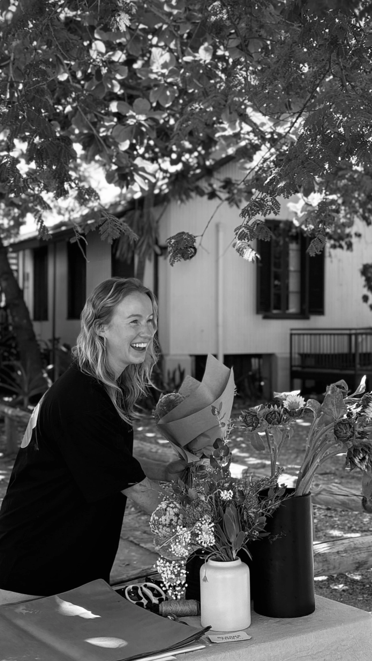Bloome Time owner Erin selling flower bouquets at market in Broome